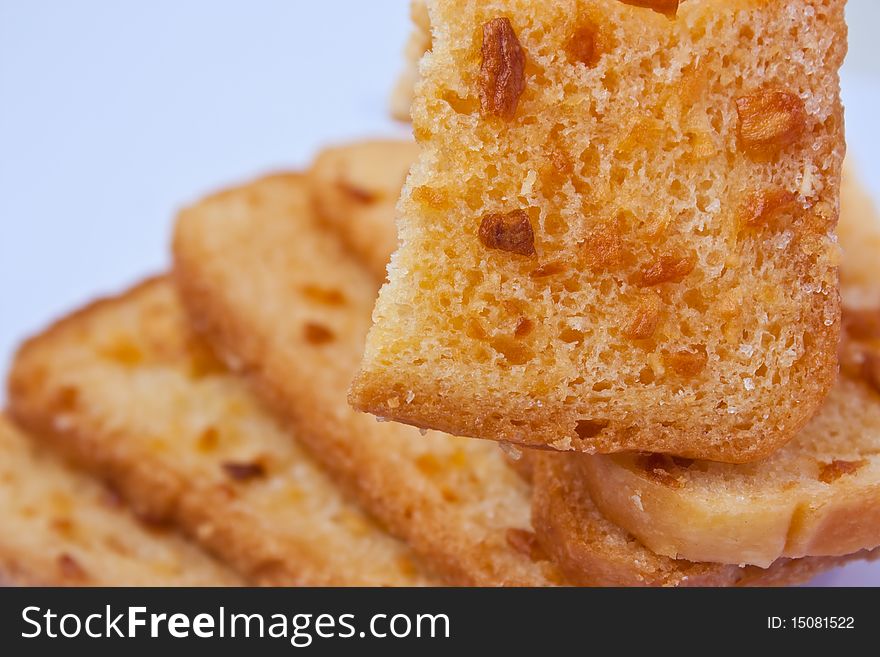 Crunchy bread with sugar on white background