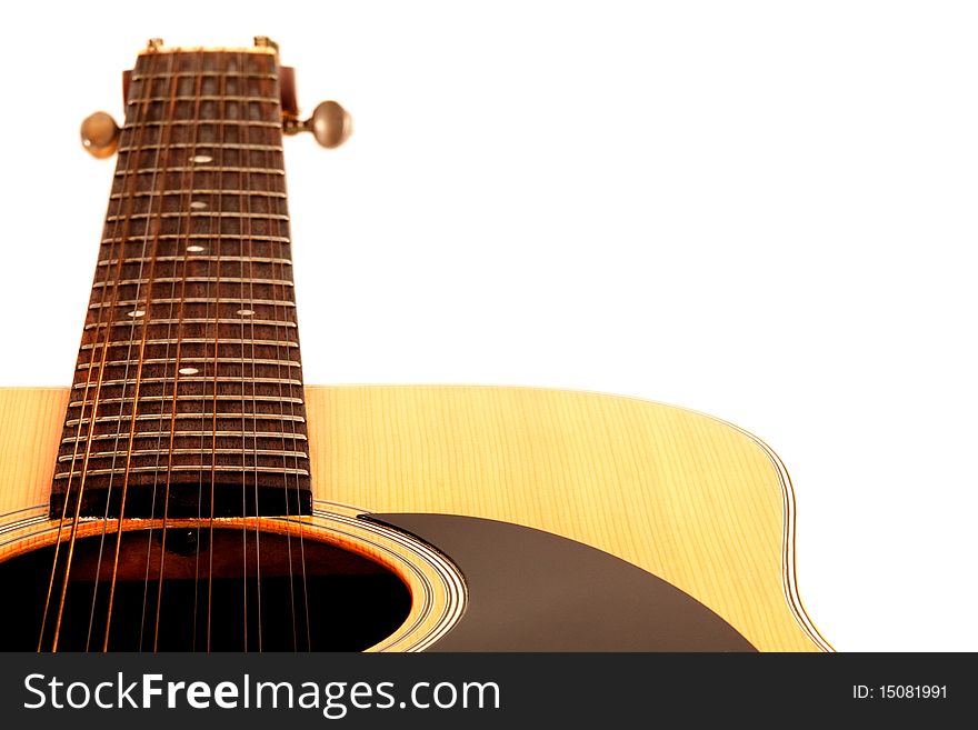 A 12 String Acoustic Guitar On A White Background