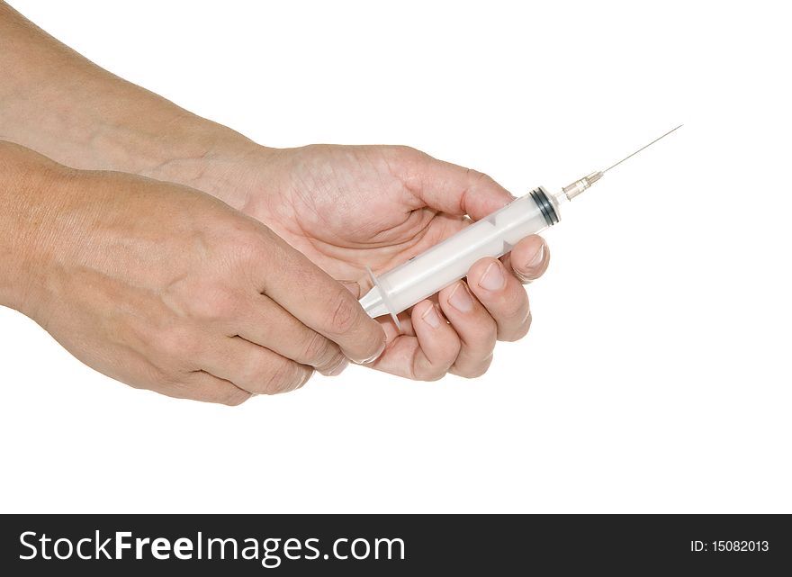 Syringe in his hand on a white background