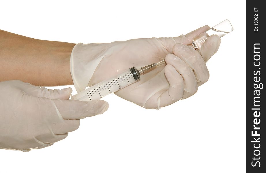 Syringe in his hand on a white background