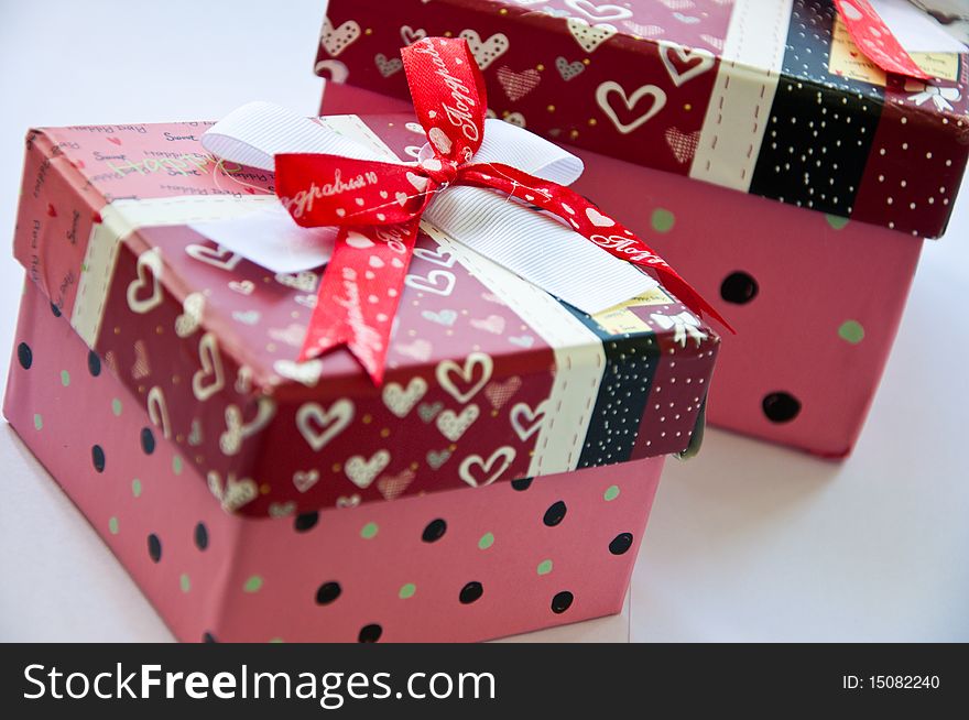 Two gift boxes with ribbon isolated on white background - Shallow depth of field - Focus on bow