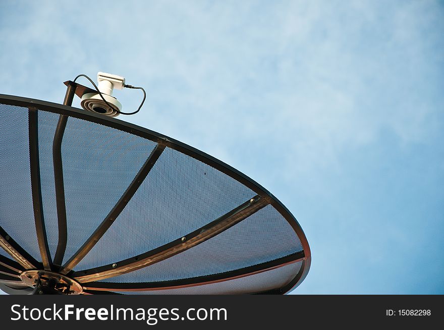 Closeup of a satellite dish with background of sky