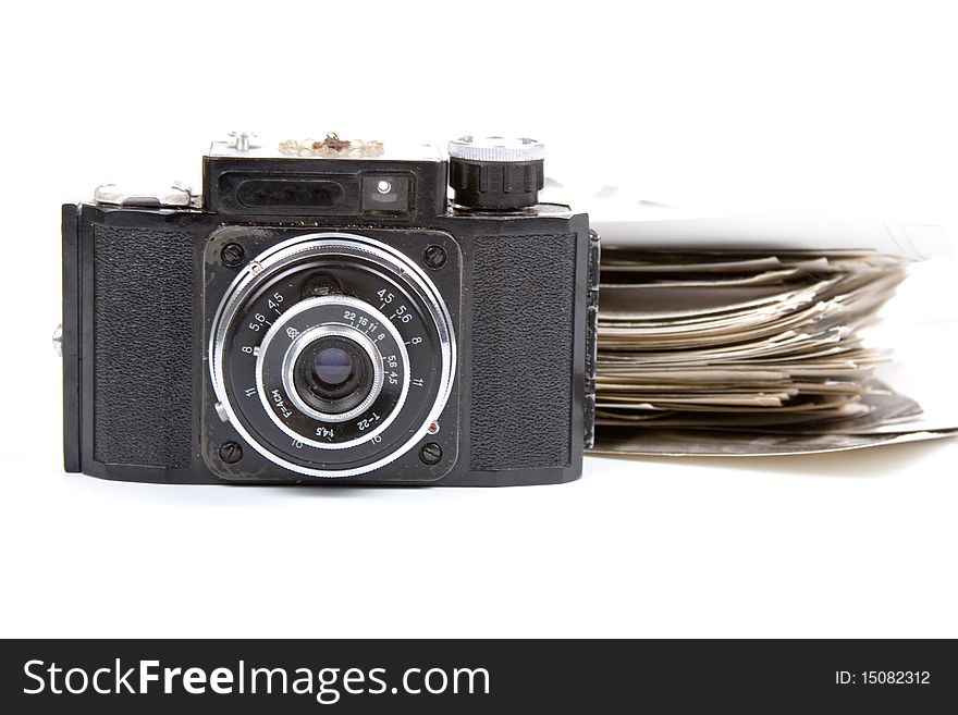 Old camera and pictures on a white background