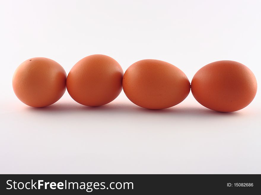 Four brown eggs isolated on a white background. Four brown eggs isolated on a white background