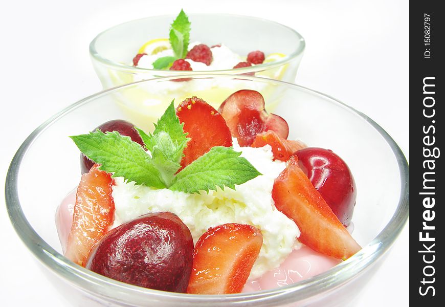 Strawberry mousse dessert with cherry and raspberry