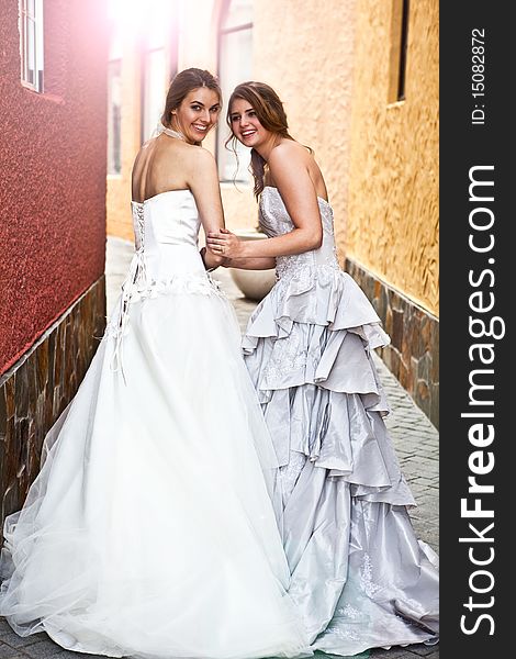 Young Bride And Bridesmaid in an Alleyway