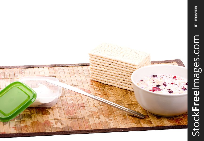 Healthy breakfast with cottage cheese on crispbread and muesli