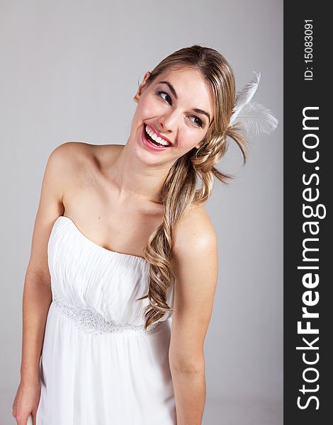 Attractive Young Woman In A White Dress