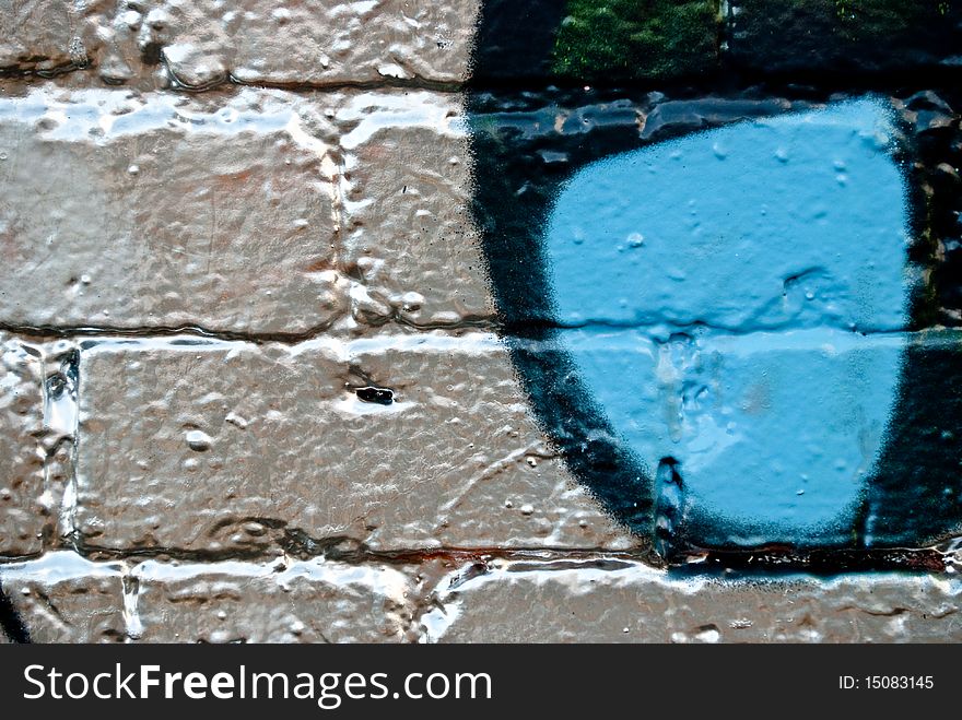 Graffiti detail on the textured Brick Wall. Graffiti detail on the textured Brick Wall