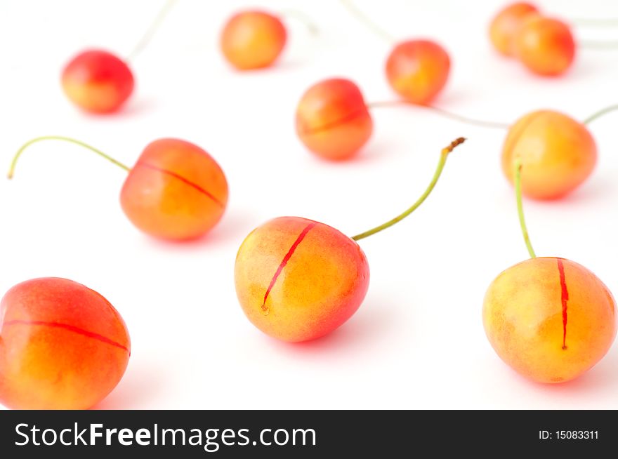 Ripe yellow and red cherries isolated on white background. Ripe yellow and red cherries isolated on white background