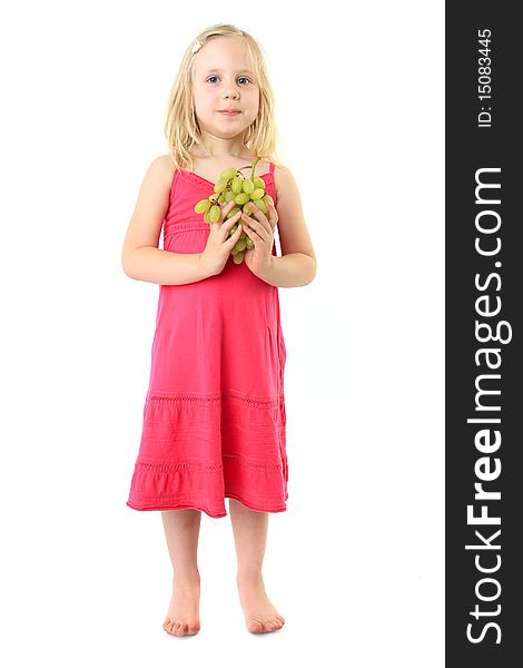 Little girl takes bunch of grape. Isolated over white