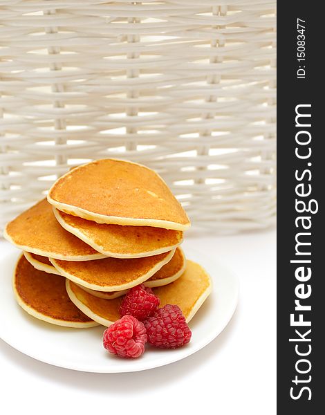 Small pancakes topped with berries. Food background