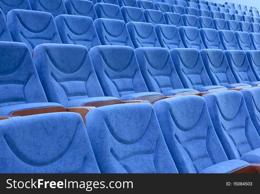 Empty blue chairs at cinema or theater