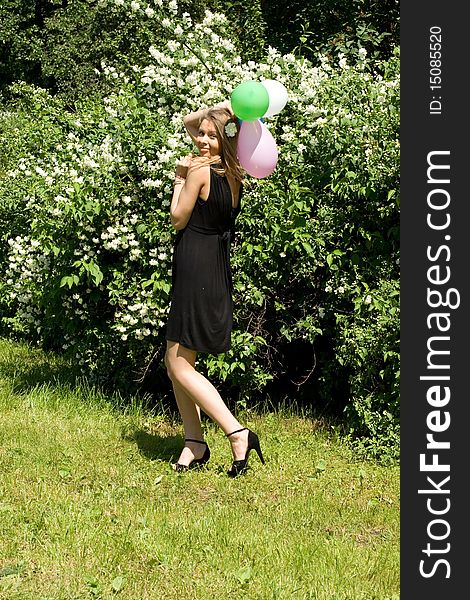 Joyful girl with balloons outdoor