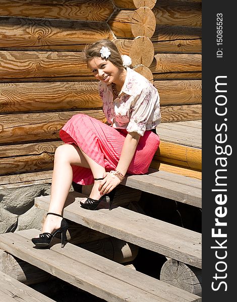 Girl sitting on a veranda. Girl sitting on a veranda