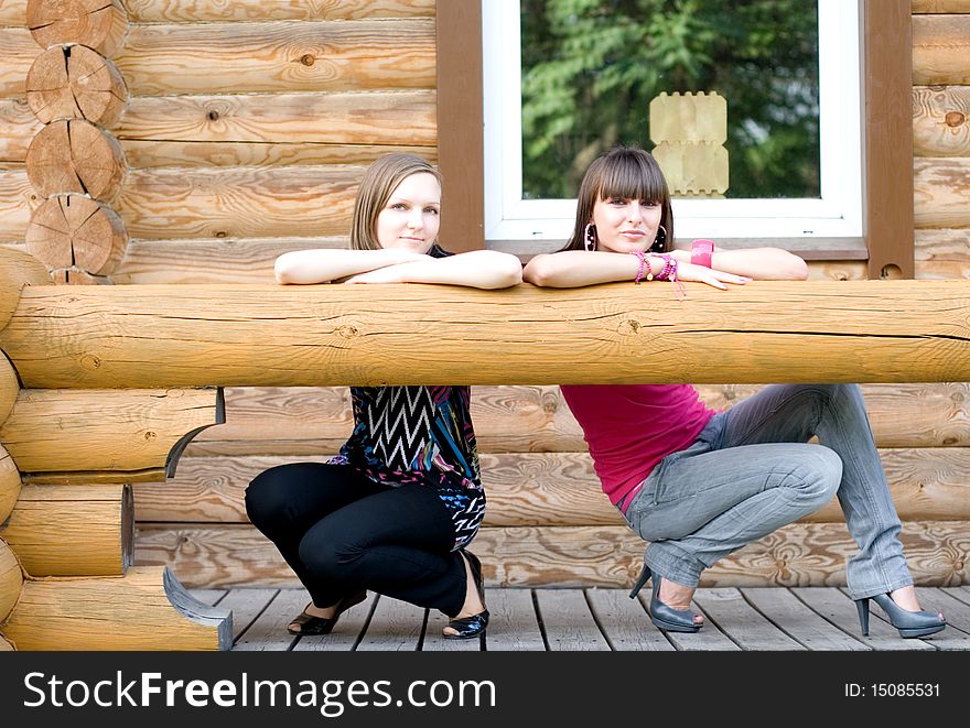 Two female friends on a veranda