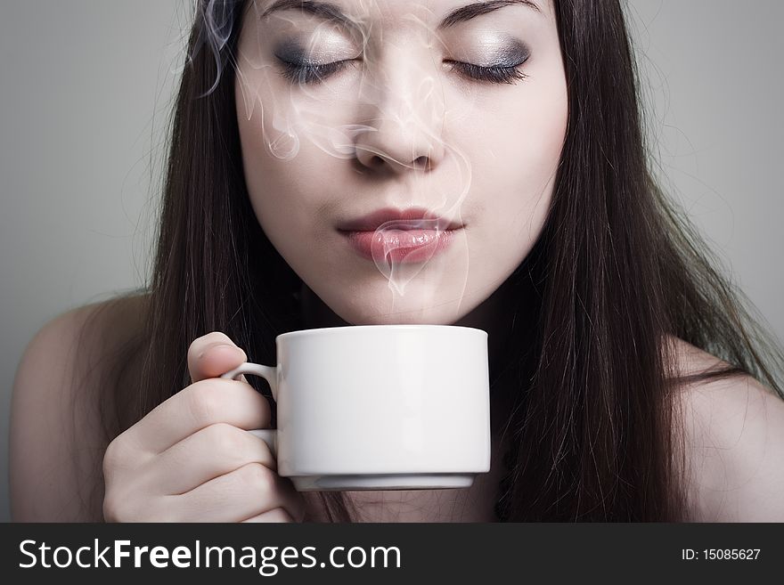 Portrait of beautiful woman drinking coffee
