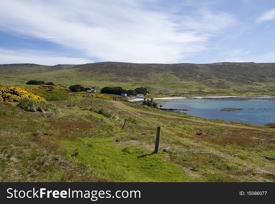 An isolated farm in a peaceful bay in the Falkland Islands. An isolated farm in a peaceful bay in the Falkland Islands.