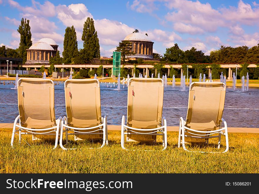 Deckchairs by the pond on a sunny day