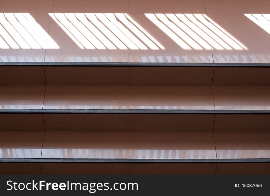 Ladder on an attic. Open staircase indoors. A corridor in office building.