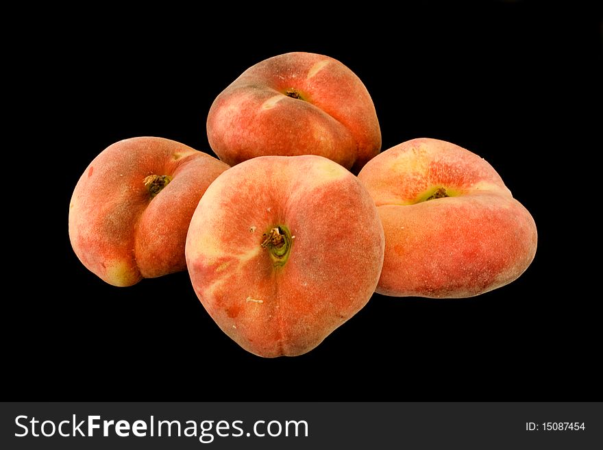 Mountain peaches (paraguayas) in isolated on black background