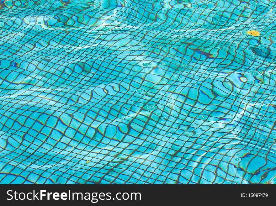 Waterpool bottom texture under water (abstract background)