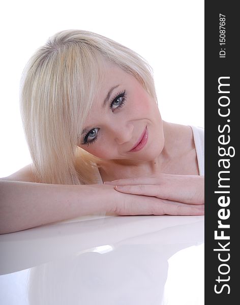 Photograph showing beautiful young blond woman in high key portrait isolated against white. Photograph showing beautiful young blond woman in high key portrait isolated against white