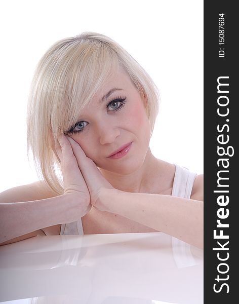 Photograph showing beautiful young blond woman in high key portrait isolated against white. Photograph showing beautiful young blond woman in high key portrait isolated against white