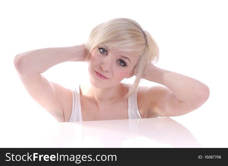 Photograph showing beautiful young blond woman in high key portrait isolated against white. Photograph showing beautiful young blond woman in high key portrait isolated against white