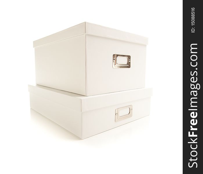 Two Stacked White File Boxes with Lids Isolated on a White Background. Two Stacked White File Boxes with Lids Isolated on a White Background.