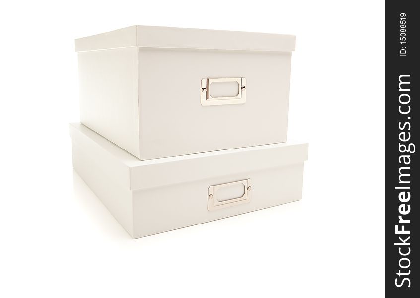 Two Stacked White File Boxes with Lids Isolated on a White Background. Two Stacked White File Boxes with Lids Isolated on a White Background.