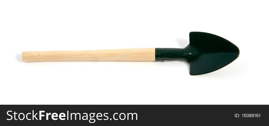 A green garden shovel