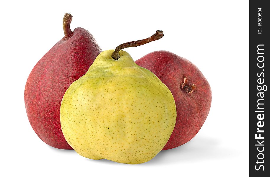 One yellow and two red pears over white background. One yellow and two red pears over white background