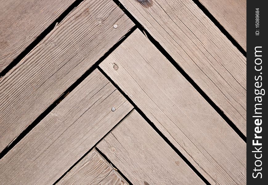Herringbone or parquet pattern in wood planks or decking. Herringbone or parquet pattern in wood planks or decking