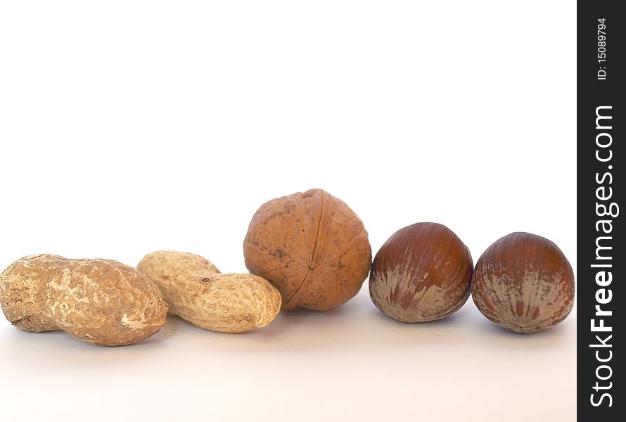 Three types of nuts on a white background