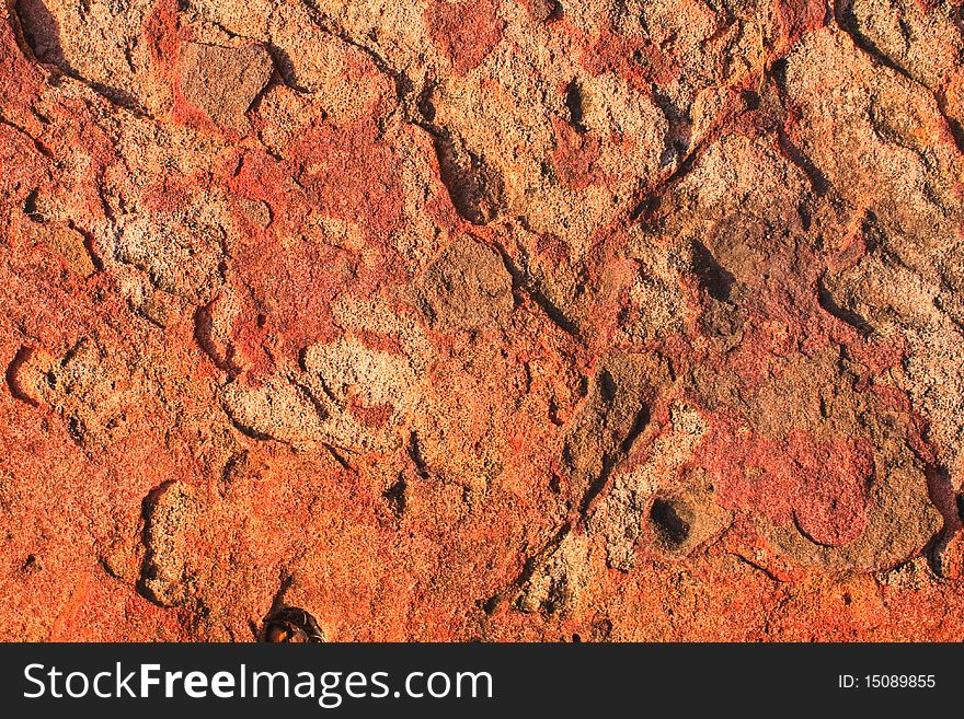 Orange stone texture pattern in daylight