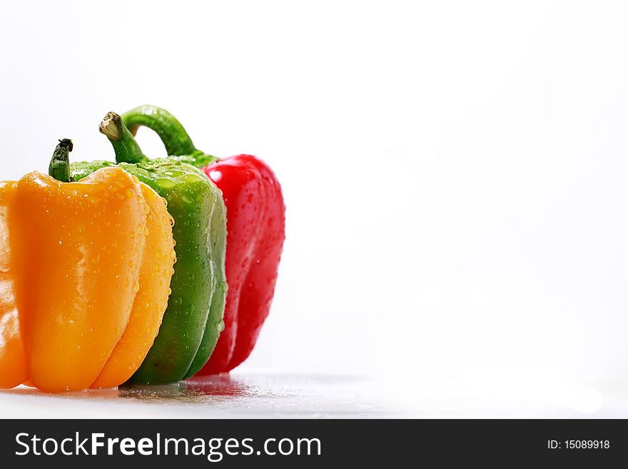 A set of assorted red, green and orange bell peppers. A set of assorted red, green and orange bell peppers