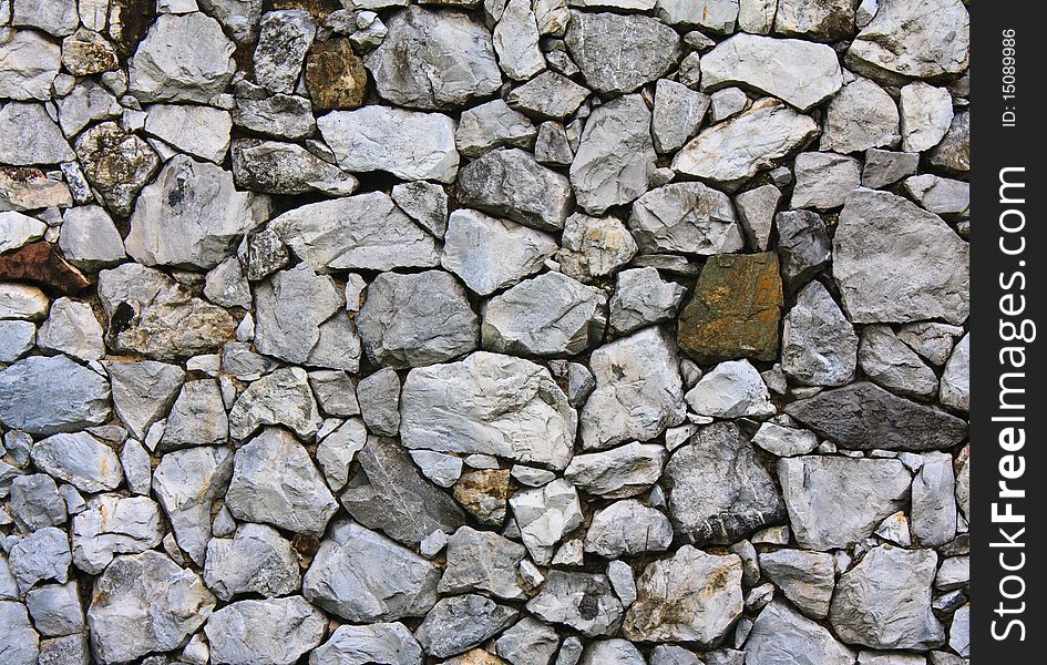 Gray strong stone wall texture pattern.