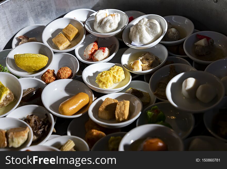 Thai style Dim Sum comes in a small   white bowls