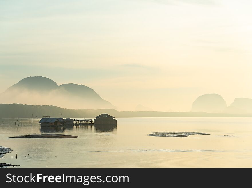 Traditional fisherman house built on sea in the morning, with fog in southern rural of Thailand