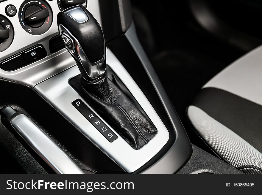 Close-up of the accelerator handle with silver metallic.  automatic transmission gear of car , car interior. Close-up of the accelerator handle with silver metallic.  automatic transmission gear of car , car interior