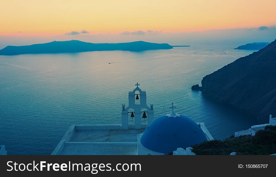 Sunset at the famous three bells in fira on the island of santorini, greece. Sunset at the famous three bells in fira on the island of santorini, greece