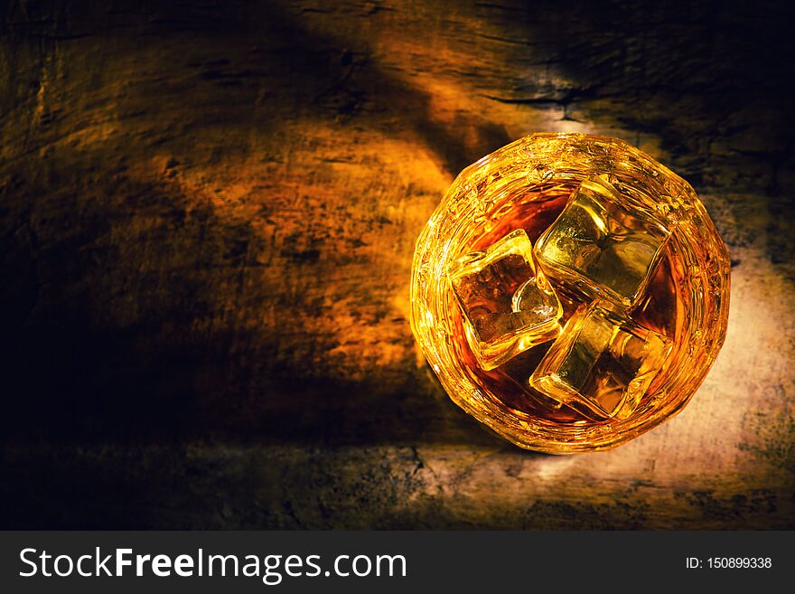 whiskey with ice cubes on wooden background, alcohol, alcoholic, amber, bar, beverage, black, bottle, bourbon, brandy, brown, celebration, close-up, cocktail, cognac, cold, copy, dark, drunk, elegance, glass, gold, golden, isolated, life, liquid, liquor, nobody, object, pouring, reflection, relaxation, restaurant, rocks, rum, scotch, shot, single, space, table, top, whisky