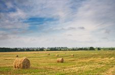 Beautiful Stubble Field With Hay Bales By Summer. Stock Photo Beautiful Stubble Field With Hay Bales By Summer. Stock Photo