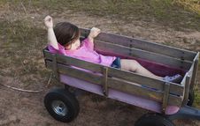 Girl In A Wagon Royalty Free Stock Images Girl In A Wagon Royalty Free Stock Images