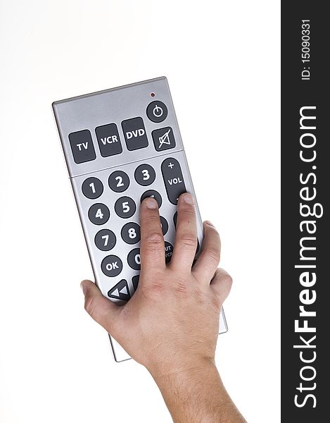 Remote control on the hand isolated on white
