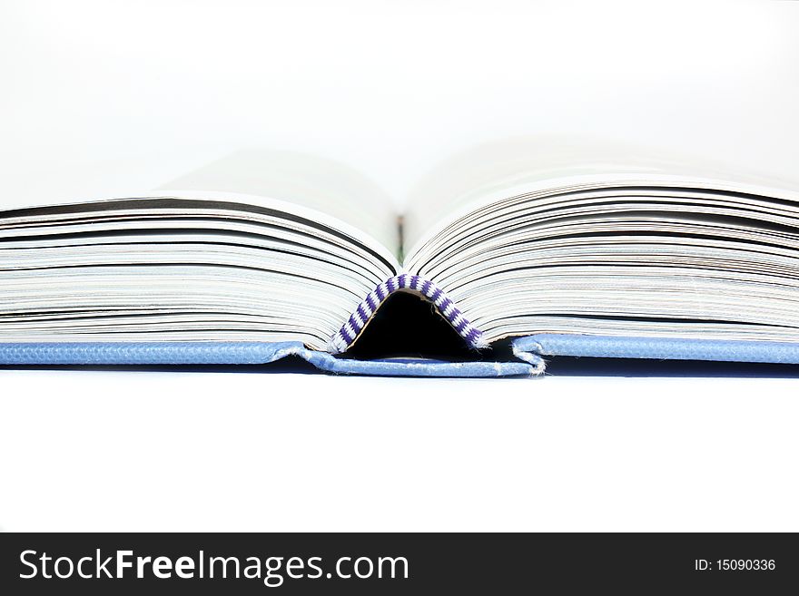 Close up of open text book isolated. Close up of open text book isolated