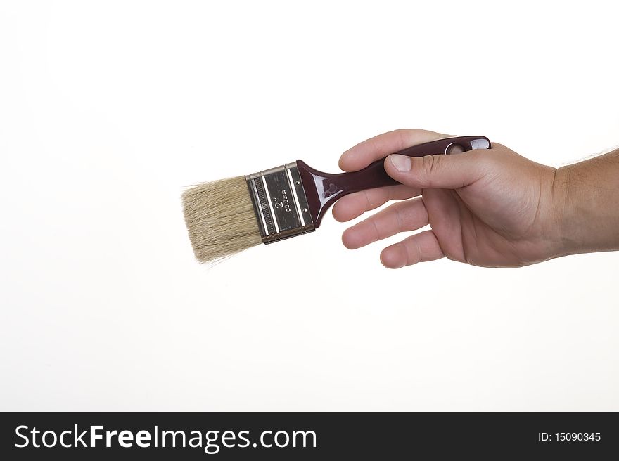 Hand with brush isolated on white background