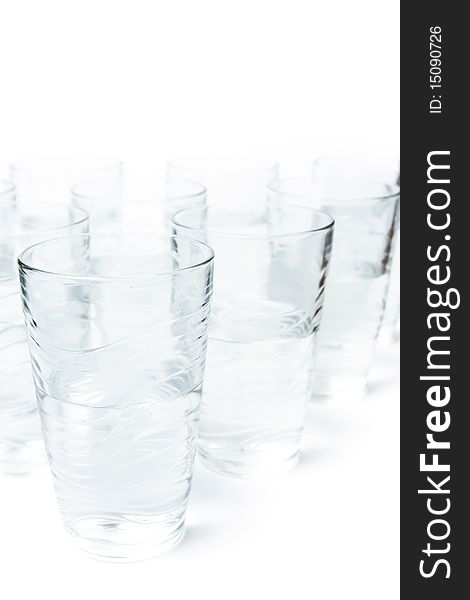 Photo of too many glasses of water half full. Photo of too many glasses of water half full