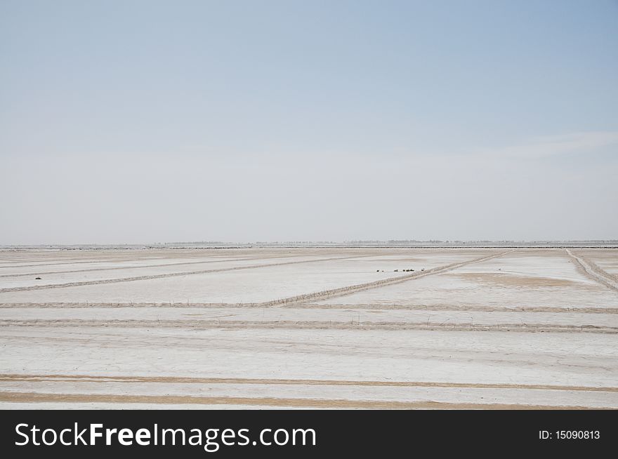 Alkaline land under the blue sky.